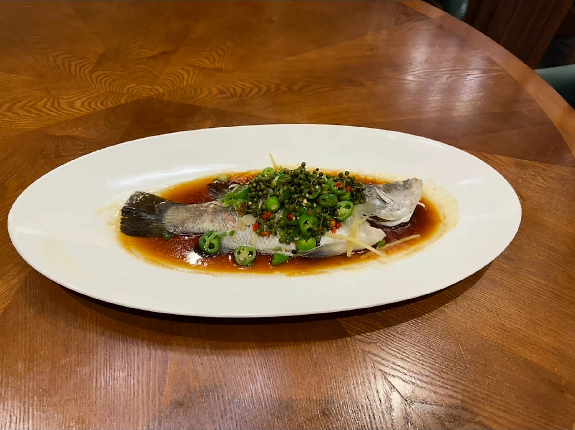青花椒呛泼桂花鱼 · Green Peppercorn Steamed Live Barramundi